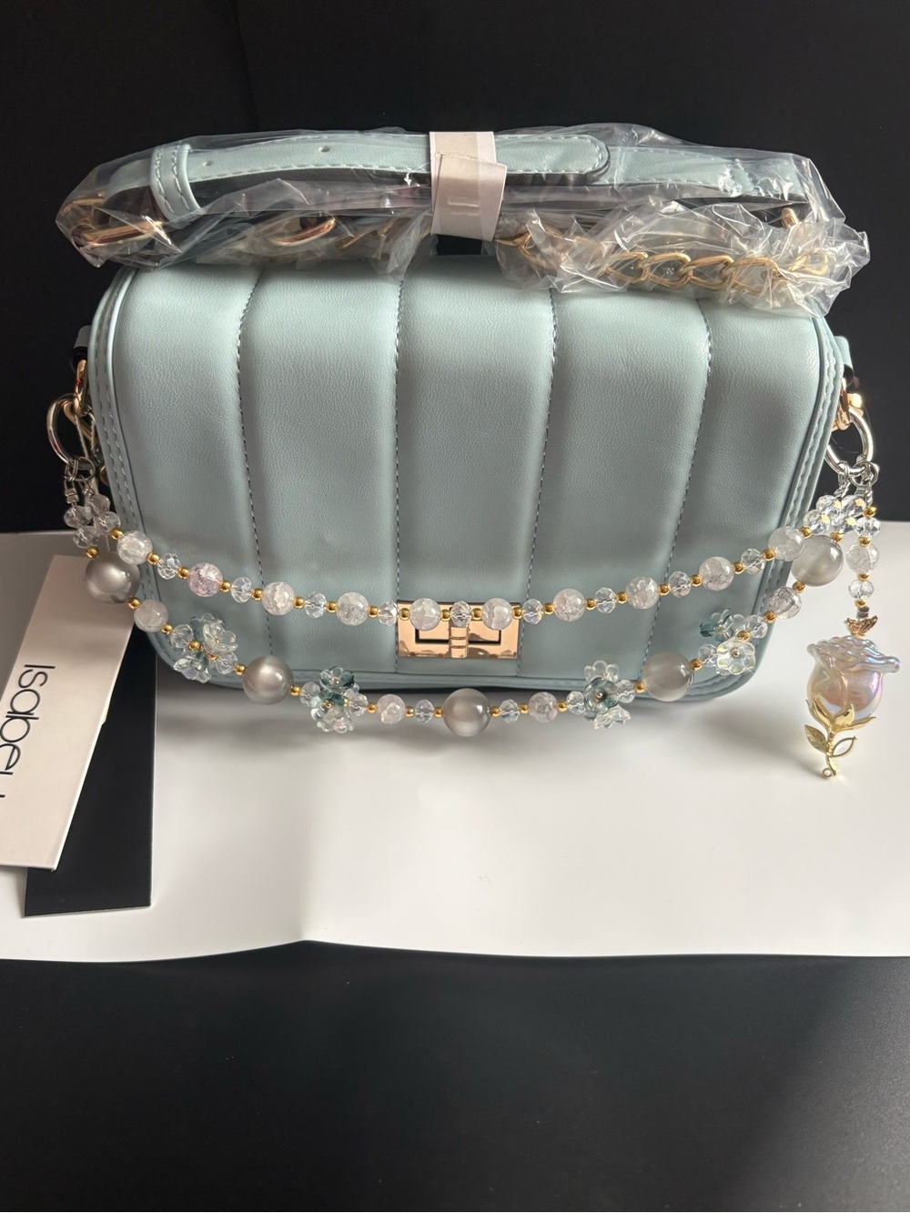 Light Blue Quilted Crossbody Bag with Decorative Beaded bag charm